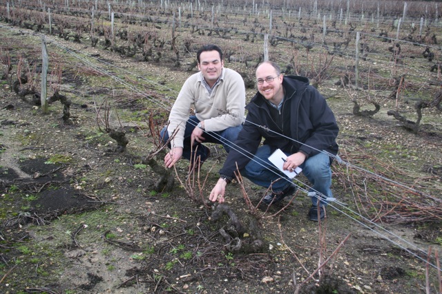 Evan in French vineyard with winemaker